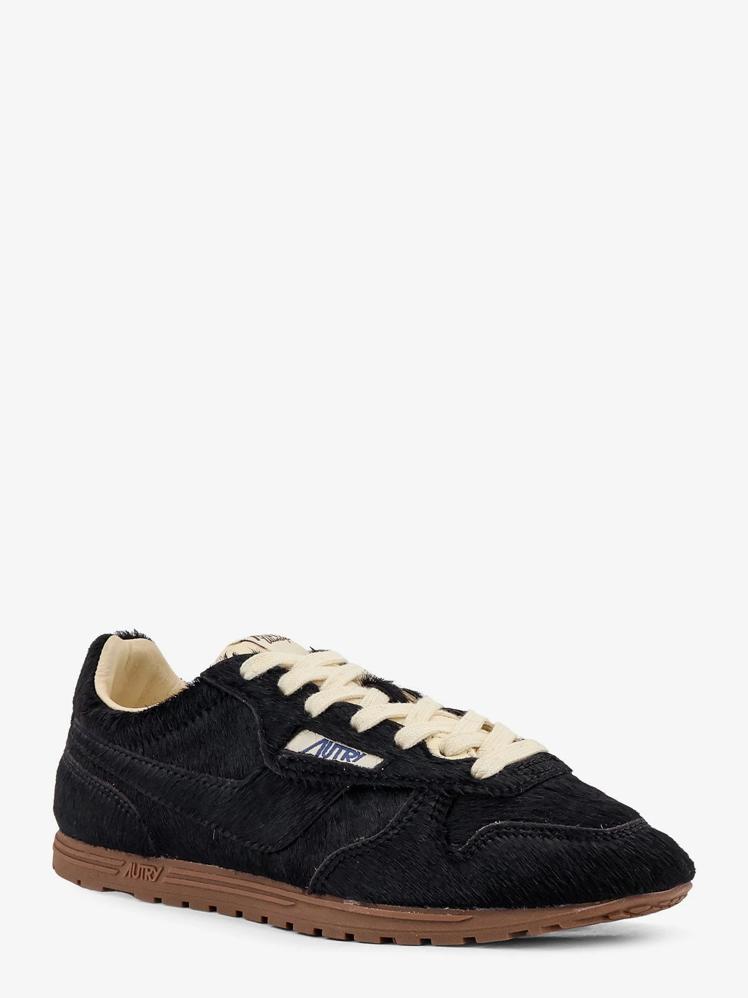 Low-top Windspin pony skin sneakers.webp