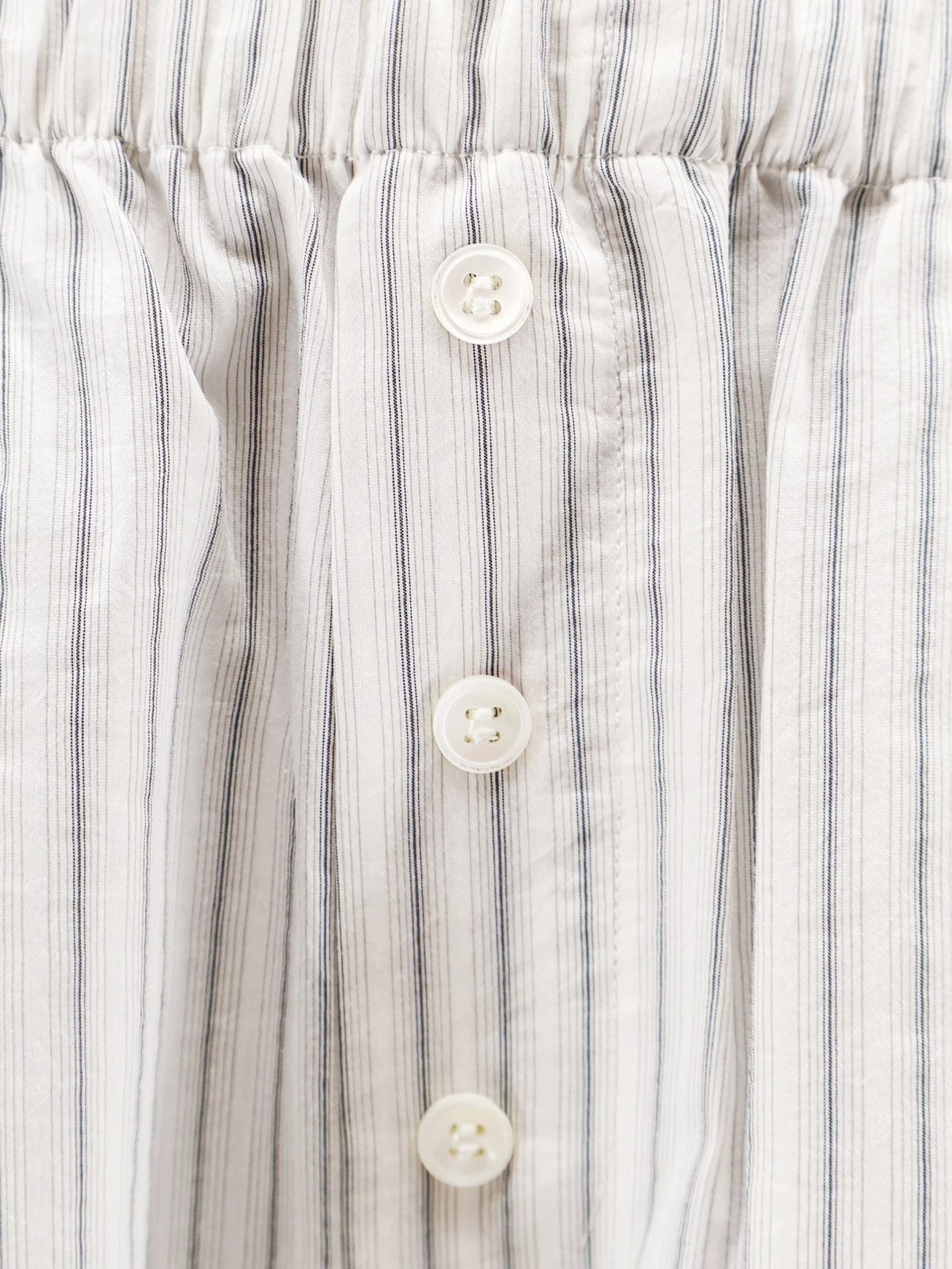 Silk trousers with striped pattern.webp