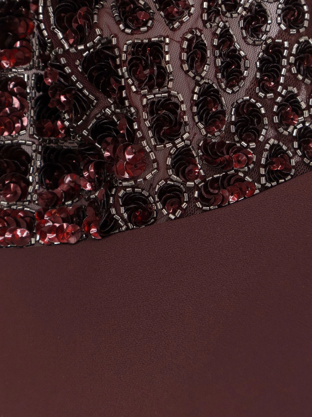 Satin suit with sewuins on the top.webp