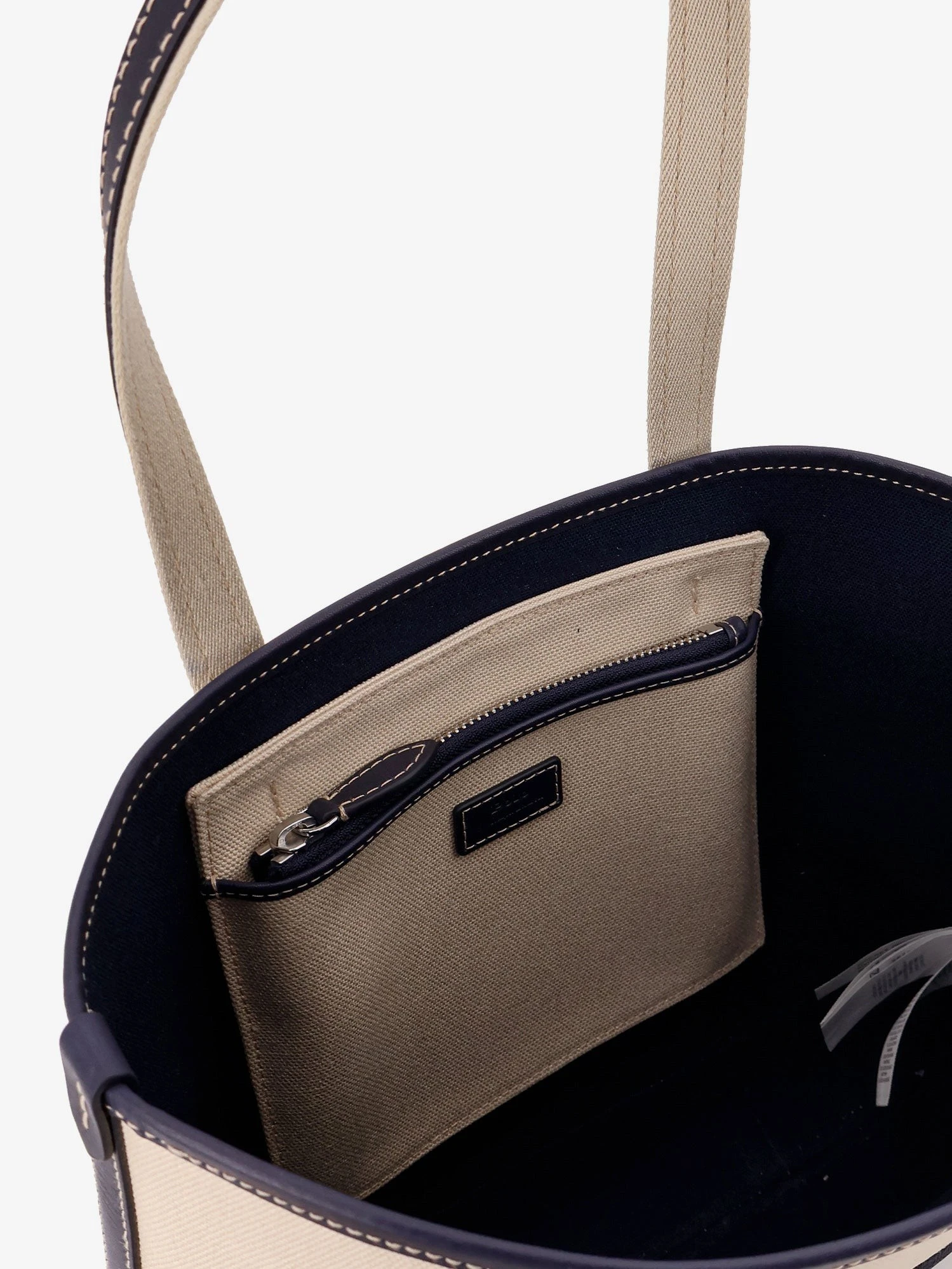 Canvas shoulder bag with embroidered logo on the front.webp