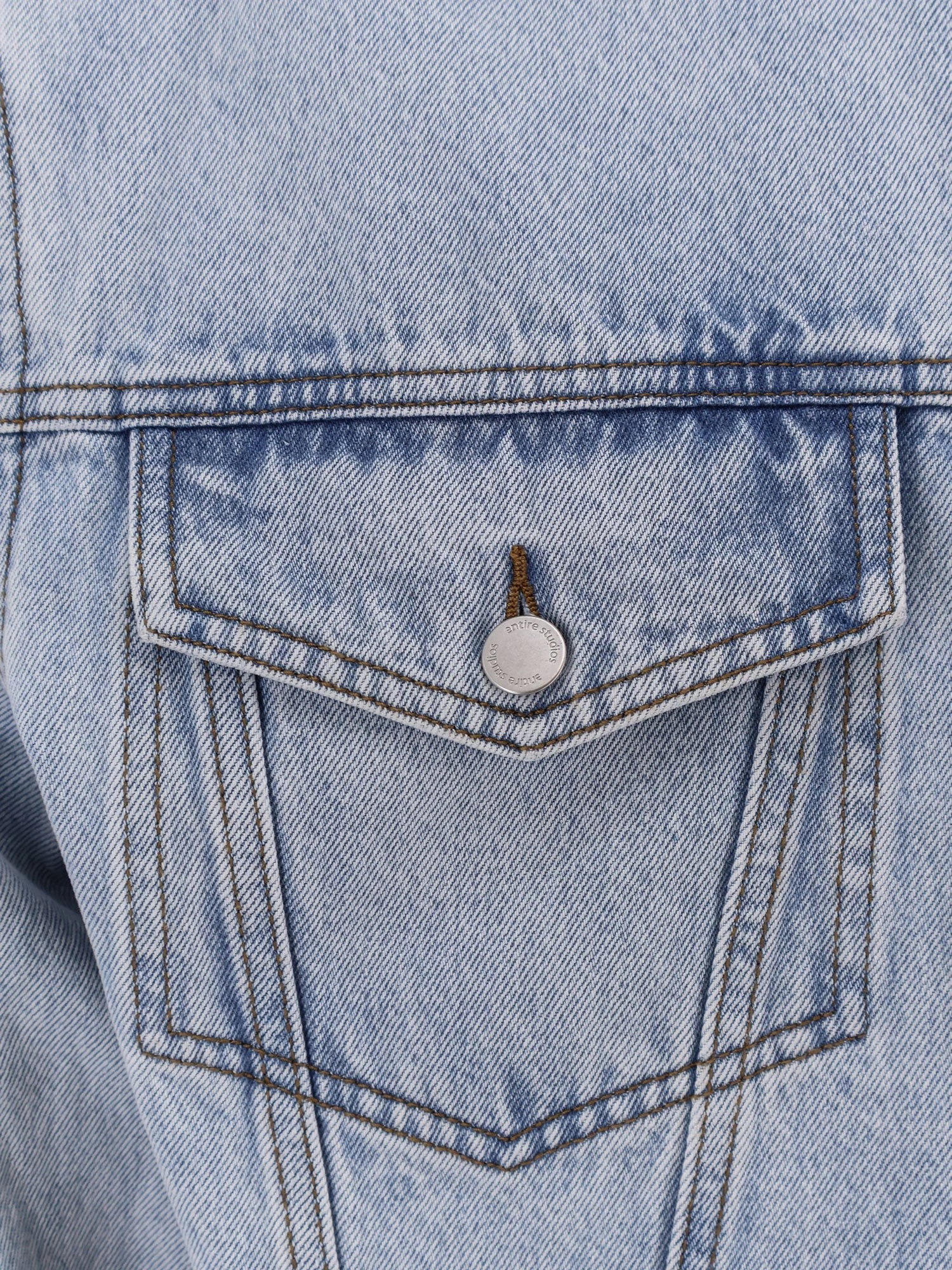 Denim jacket with padded shoulder pads.webp