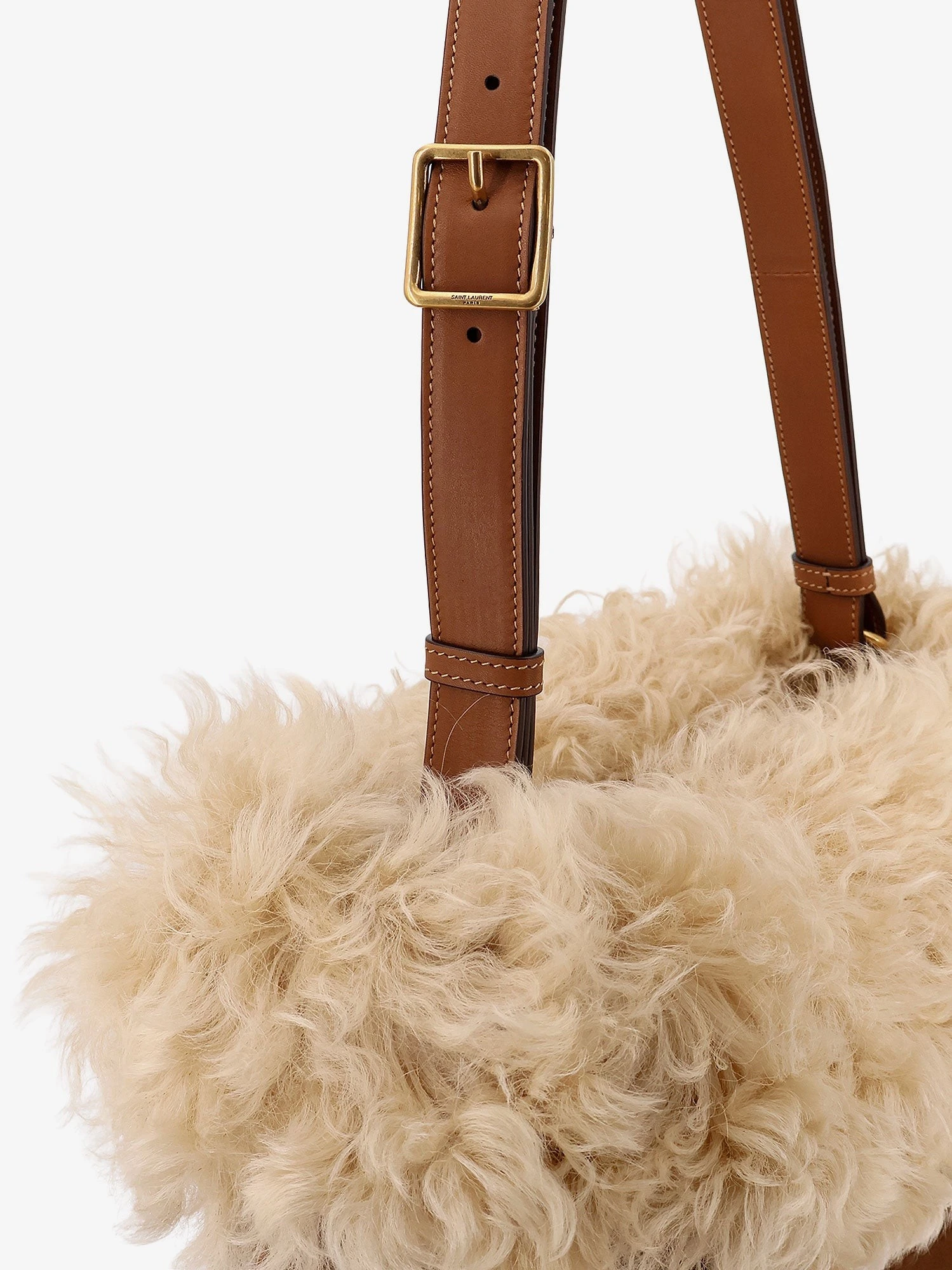 Suede shoulder bag with shearling profile.webp