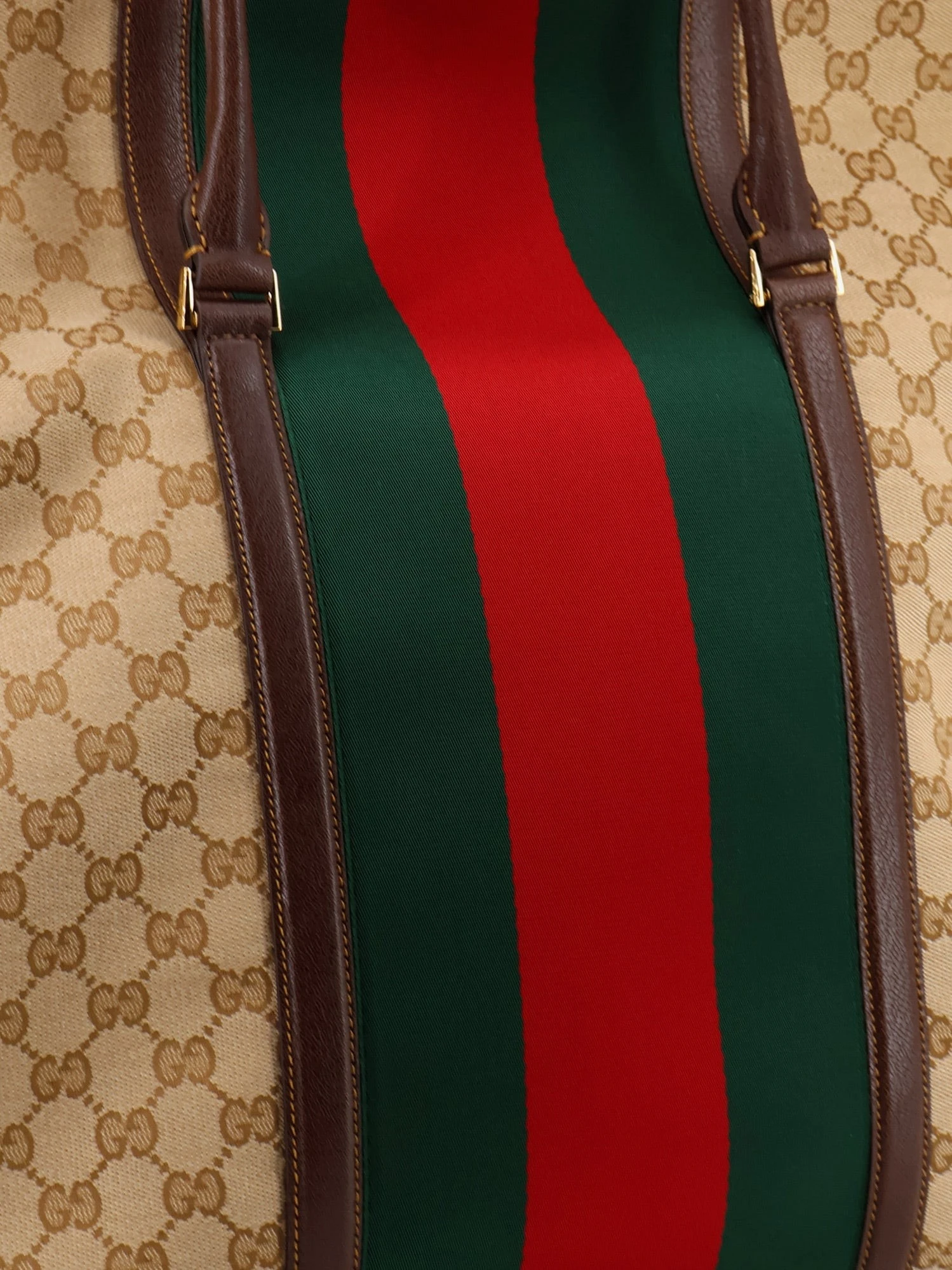 GG fabric travel bag with Web detail on the front.webp