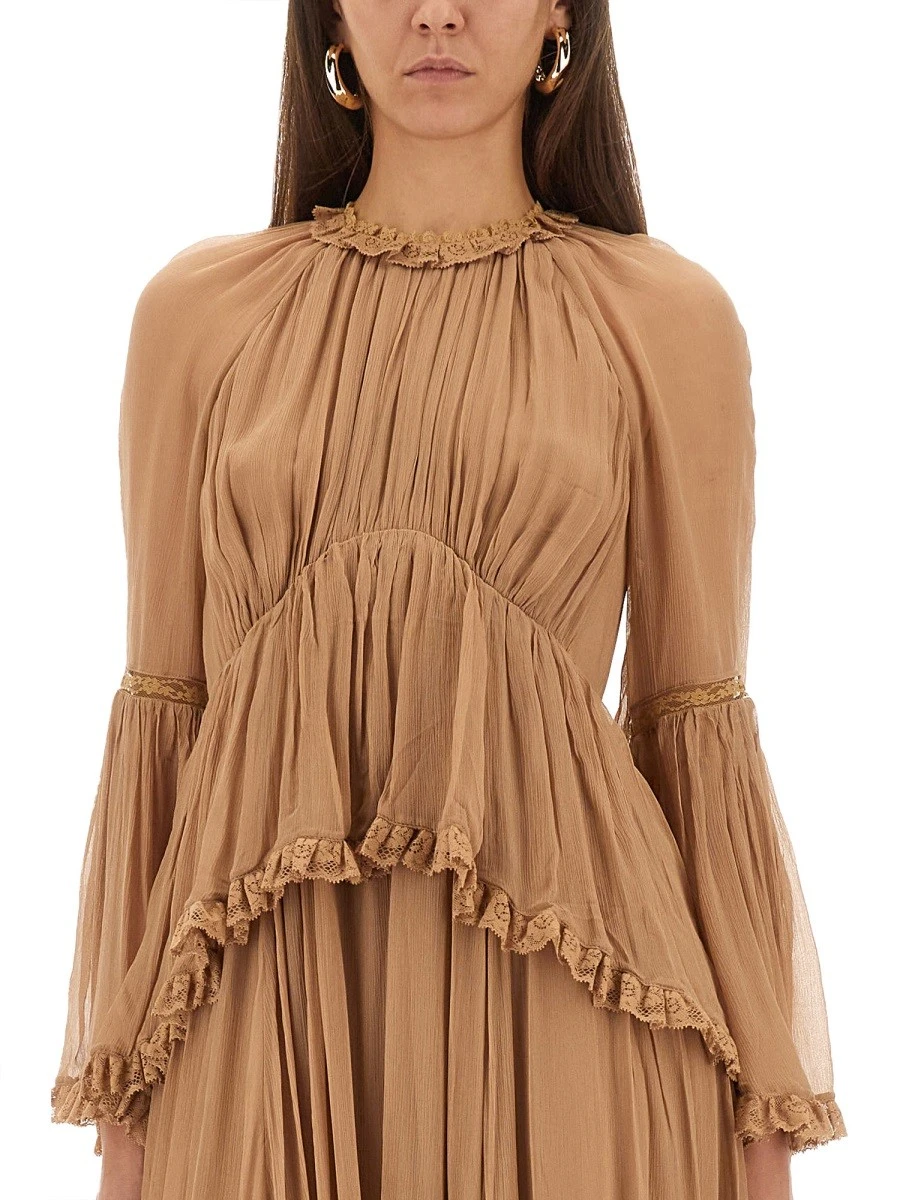 "HYPNOTIC PEPLUM" RUFFLE DRESS.webp