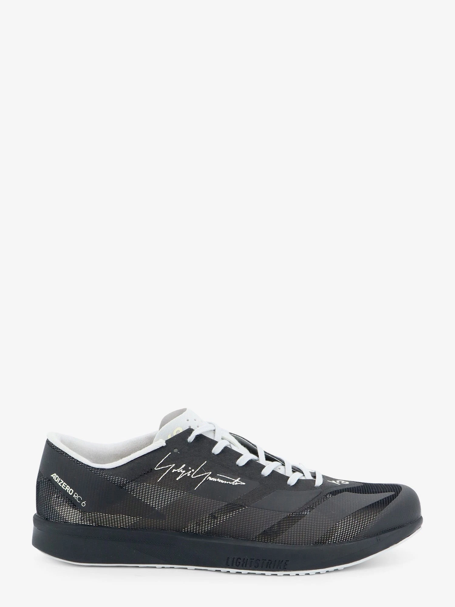 Mesh sneakers with embroidered logo on the side.webp