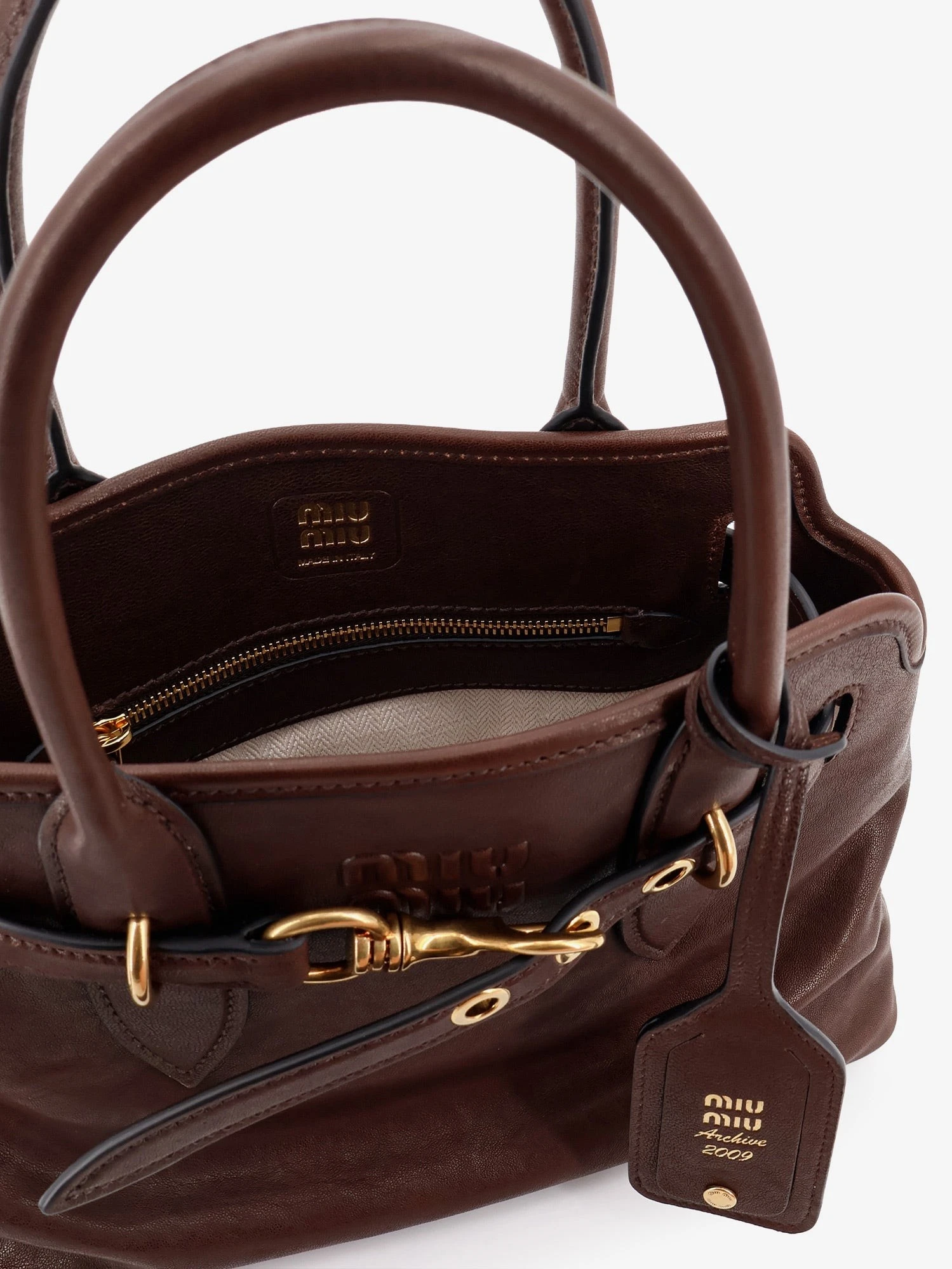 Aventure leather handbag with embossed lettering logo.webp