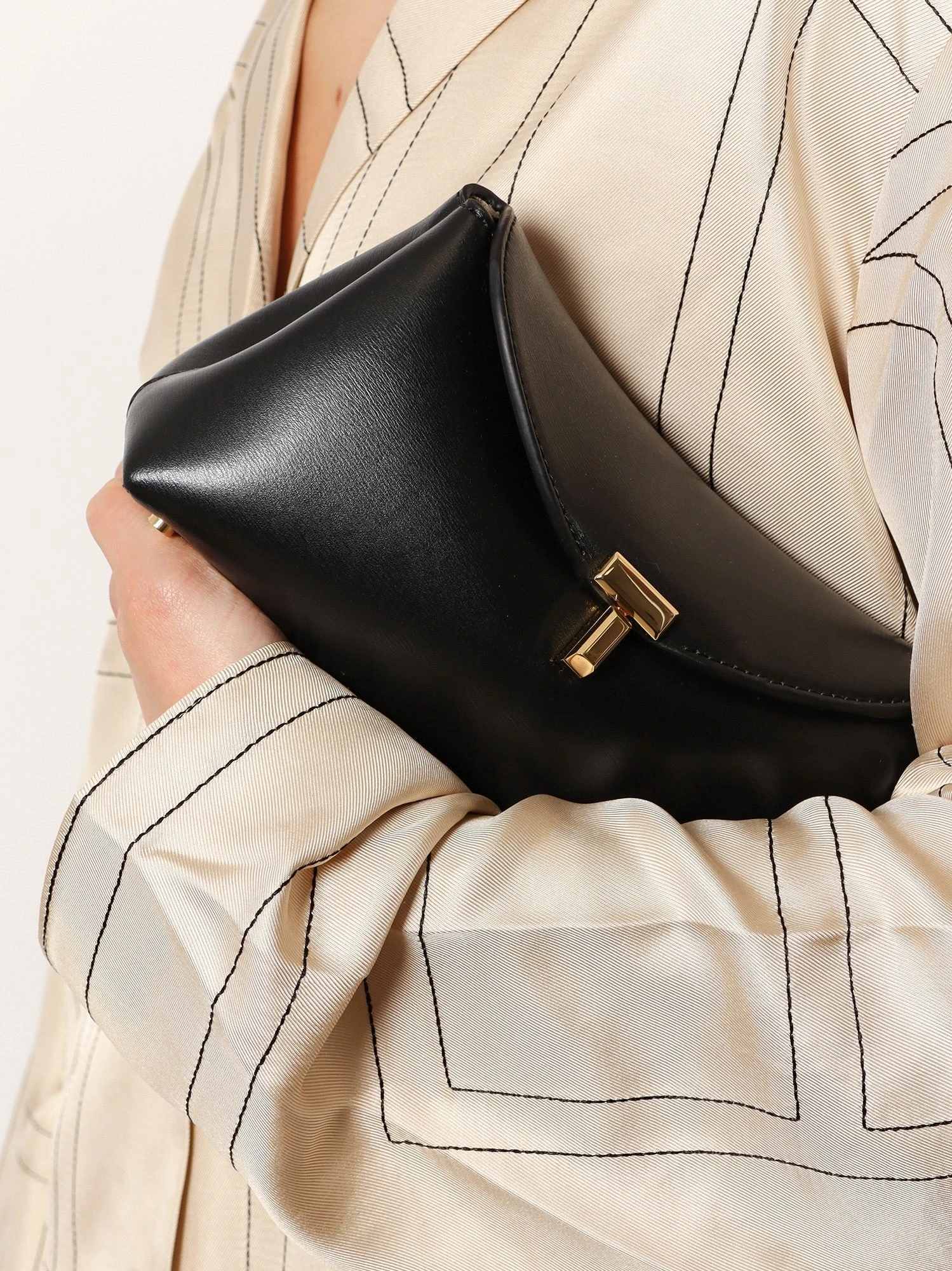 Mini T-Lock leather clutch.webp