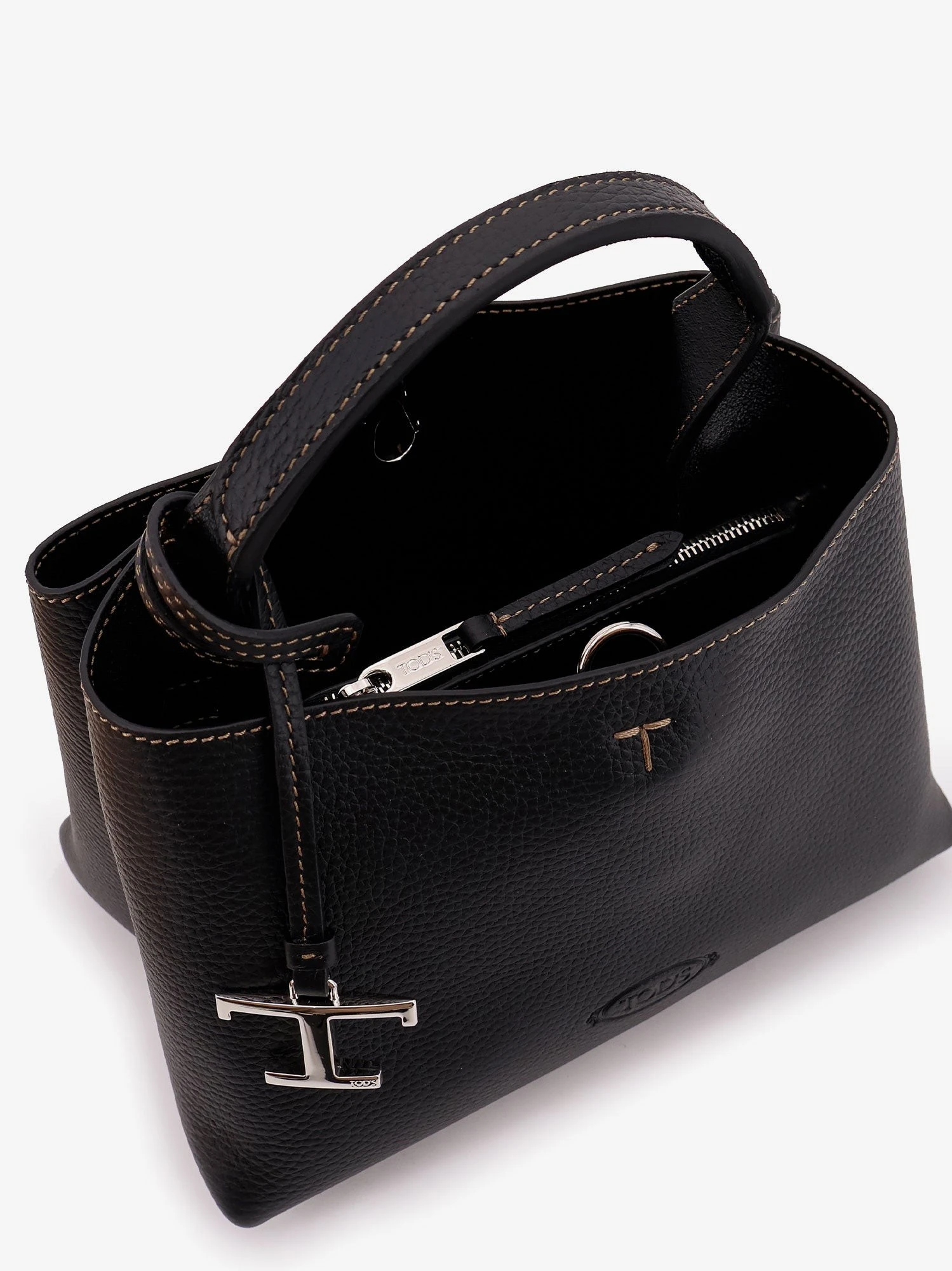 Micro leather crossbody bag with iconic stitching on the front.webp