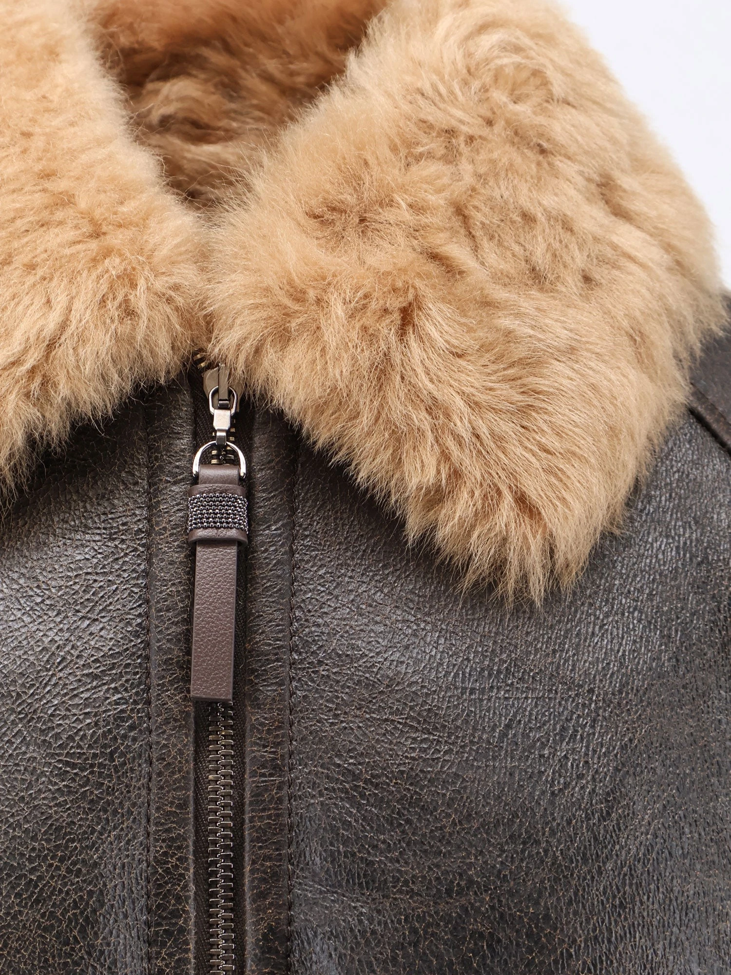 Leather jacket with shearling collar.webp