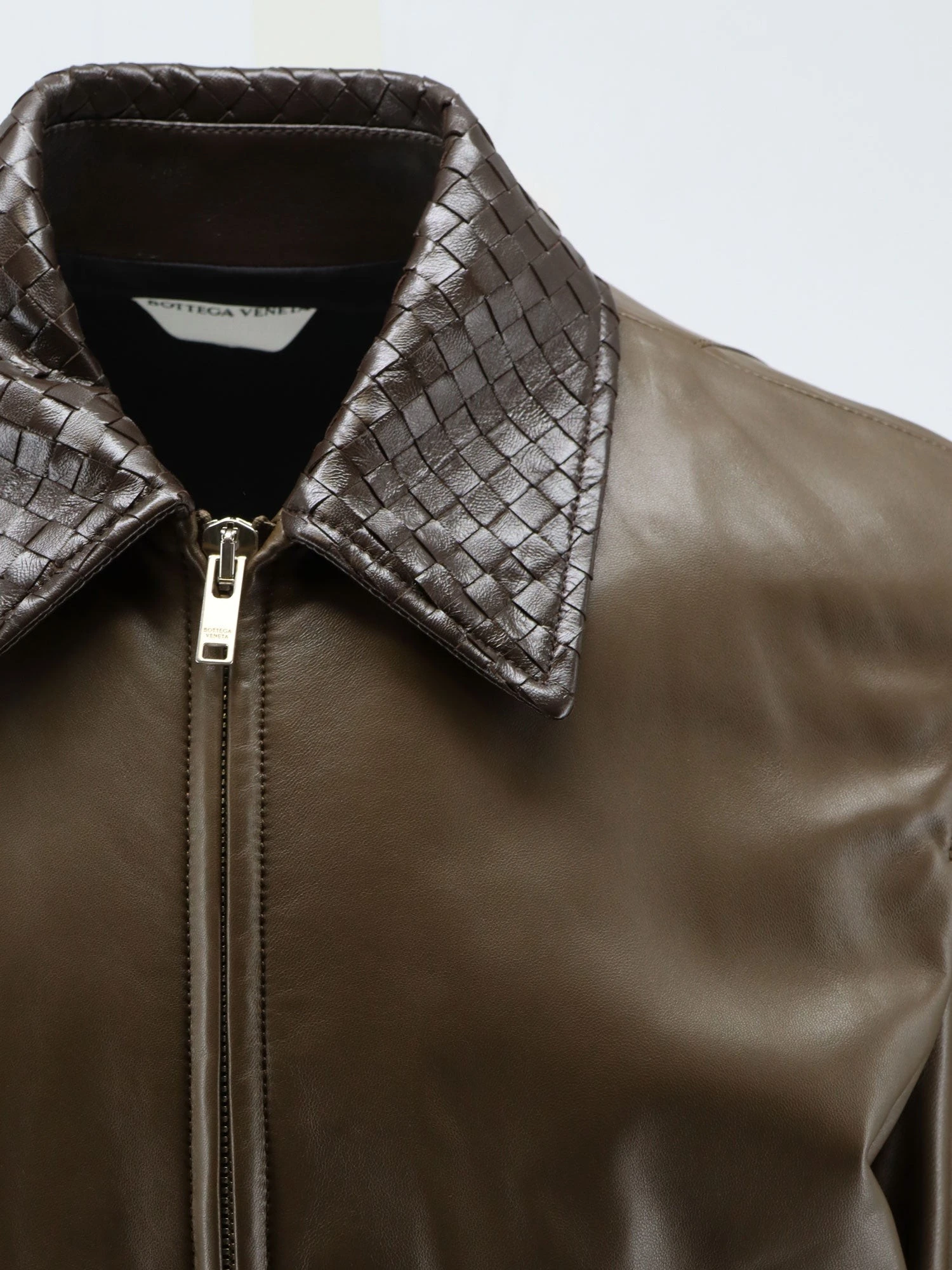 Leather Jacket with Ibntrecciato detail.webp