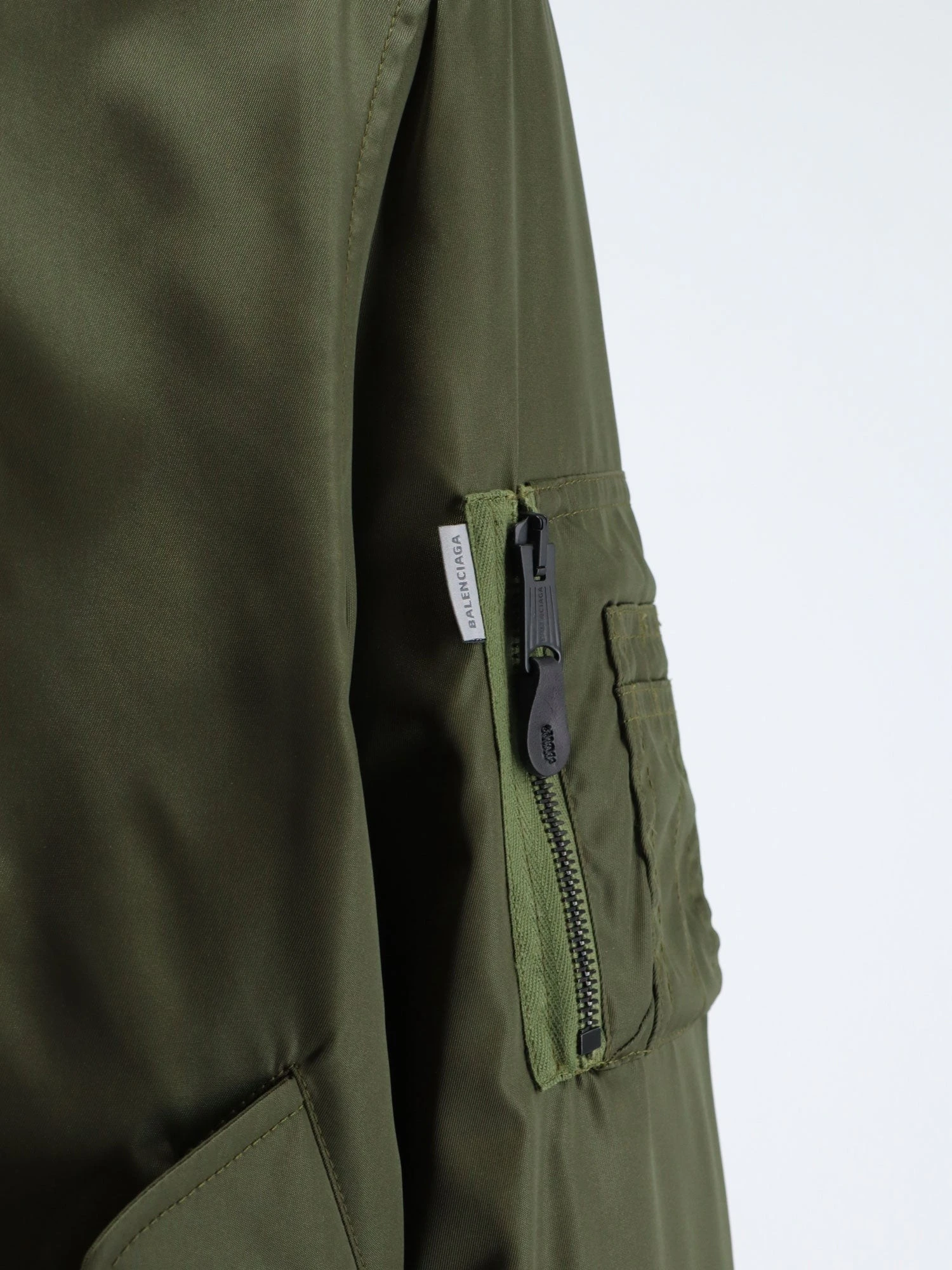 Nylon bomber with orange lining.webp