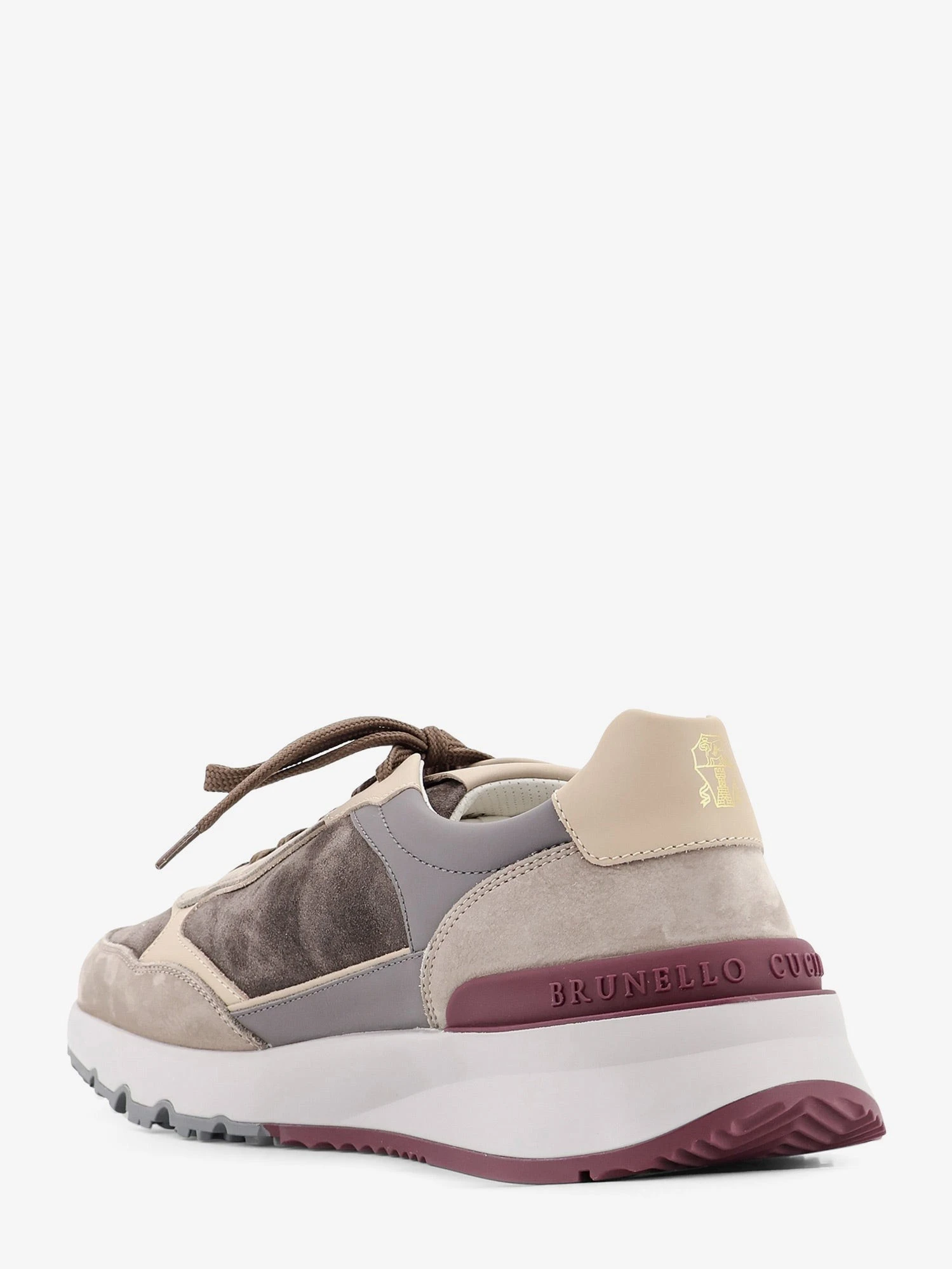 Suede sneakers with leather inserts.webp
