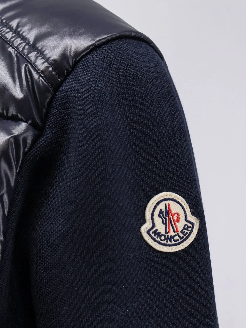 Padded jacket with fabric details.webp