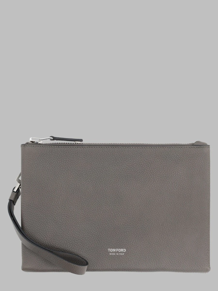 POUCHETTE MINIMAL SOTTILE IN PELLE FIORE CON CINTURINO DA POLSO.webp