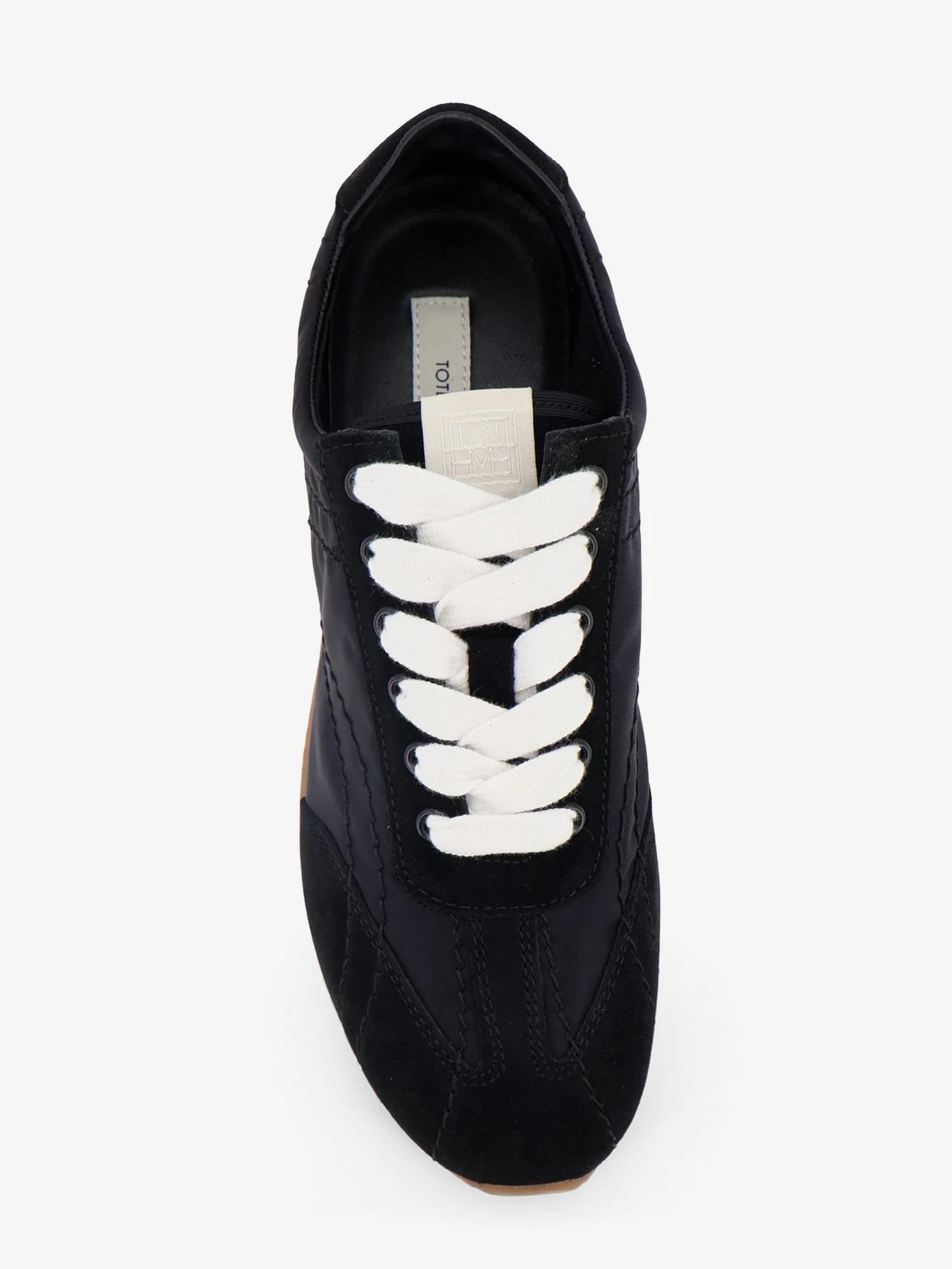 Nylon and suede sneakers with all-over stitching.webp