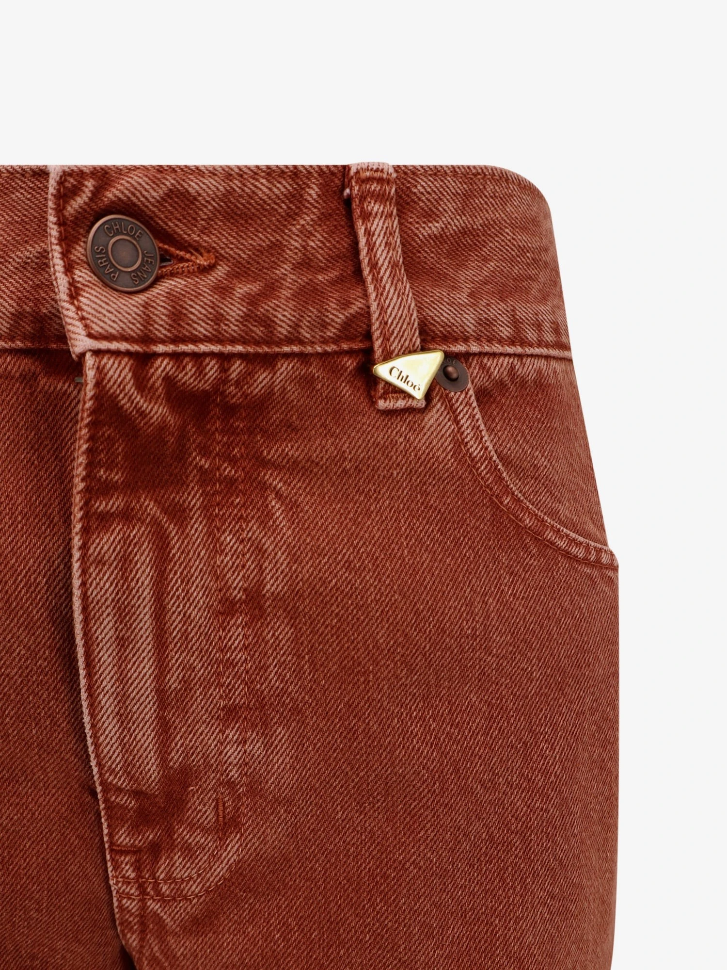 Colored denim trousers.webp