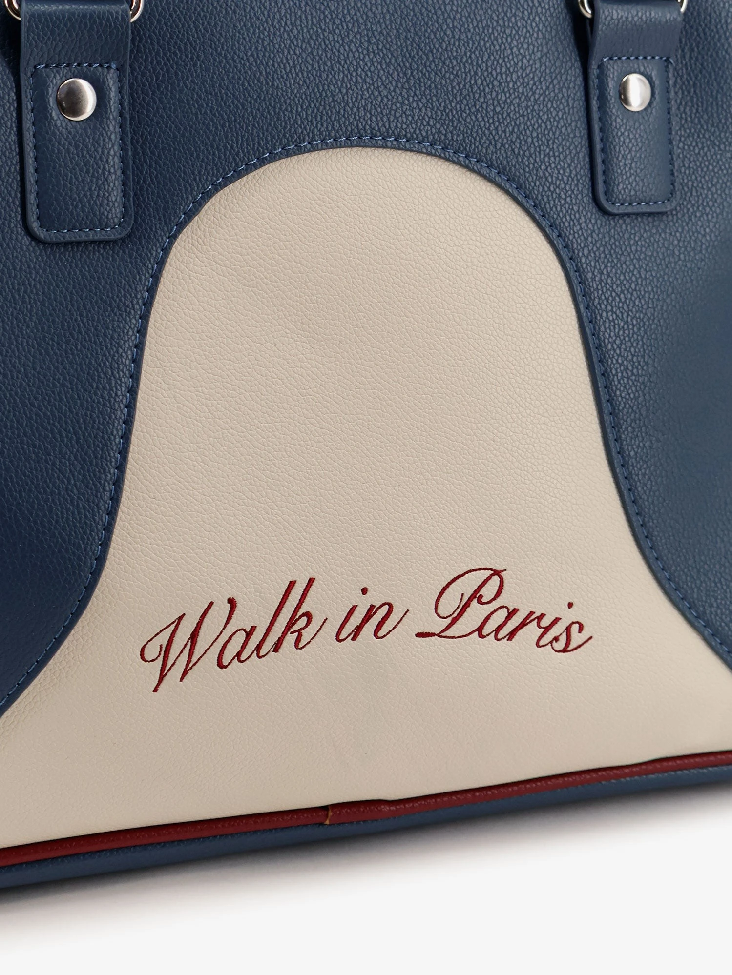 Leather crossbody bag with embroidered logo on the front.webp