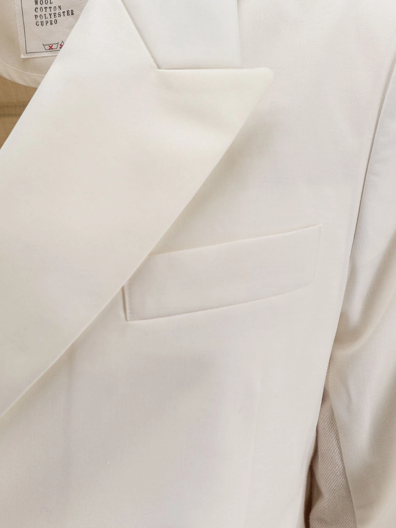 Blazer with white denim insert on the back.webp