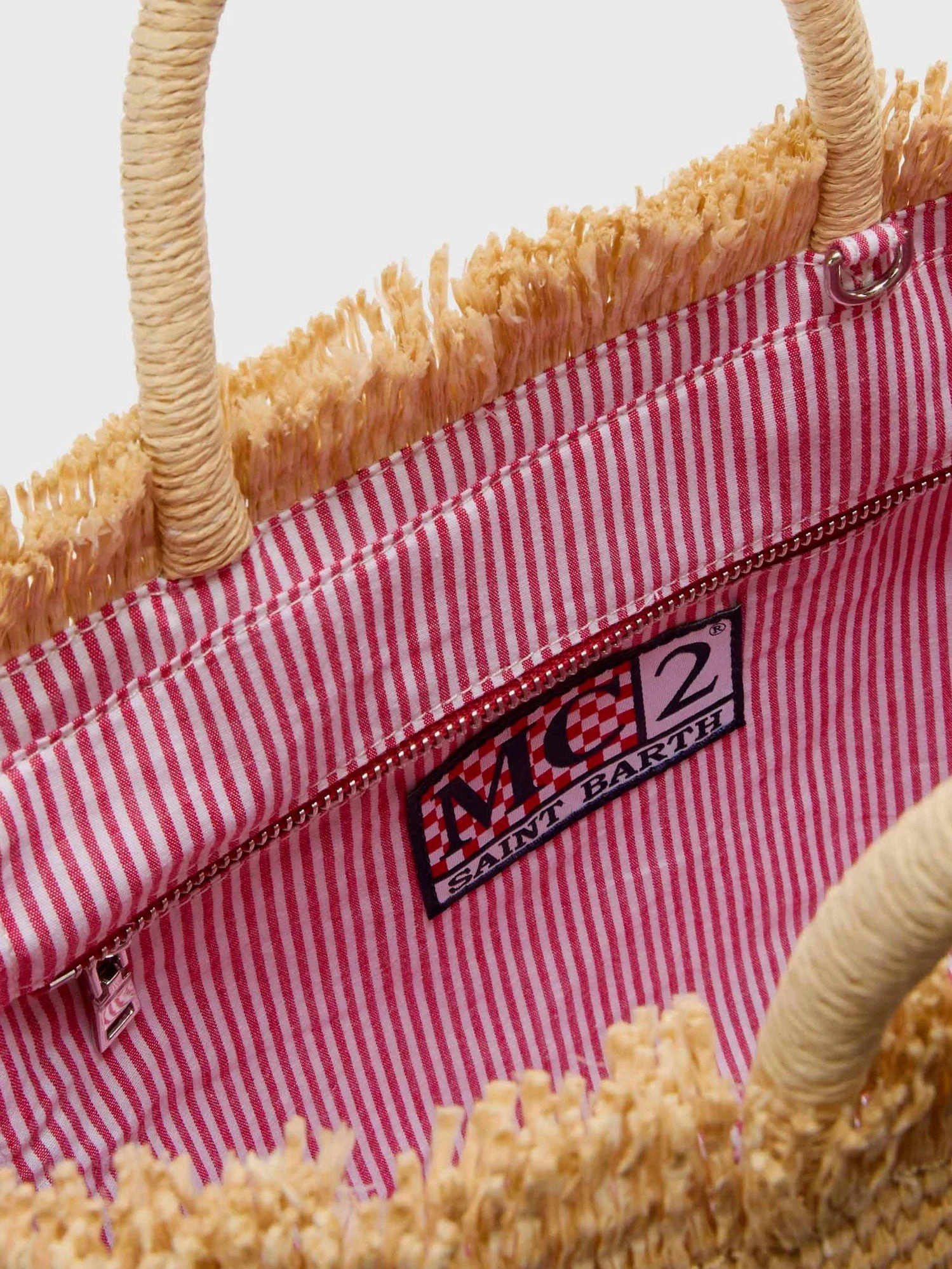 Colette raffia handbag with embroidered logo on the front.webp