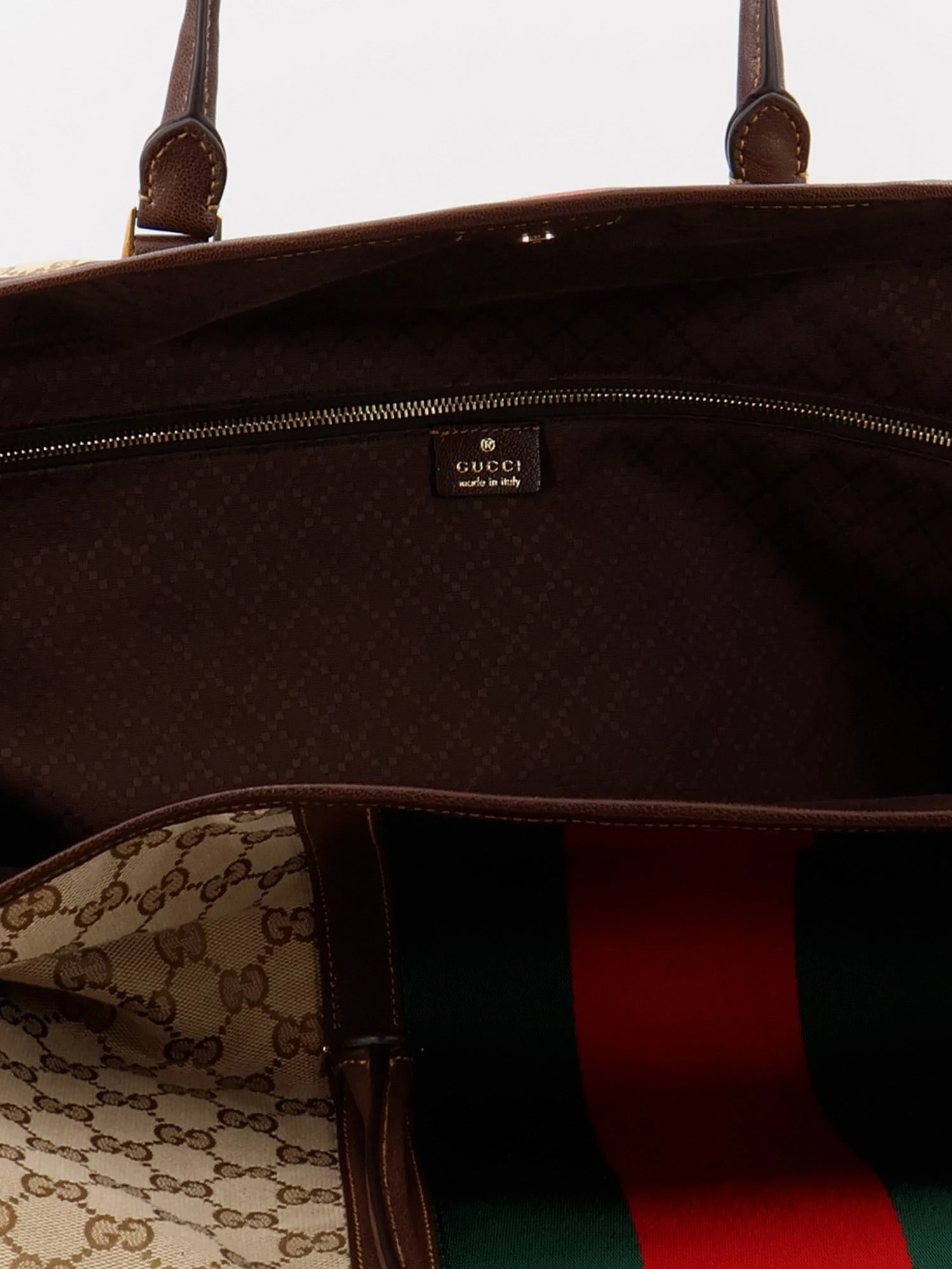 GG fabric travel bag with Web detail on the front.webp