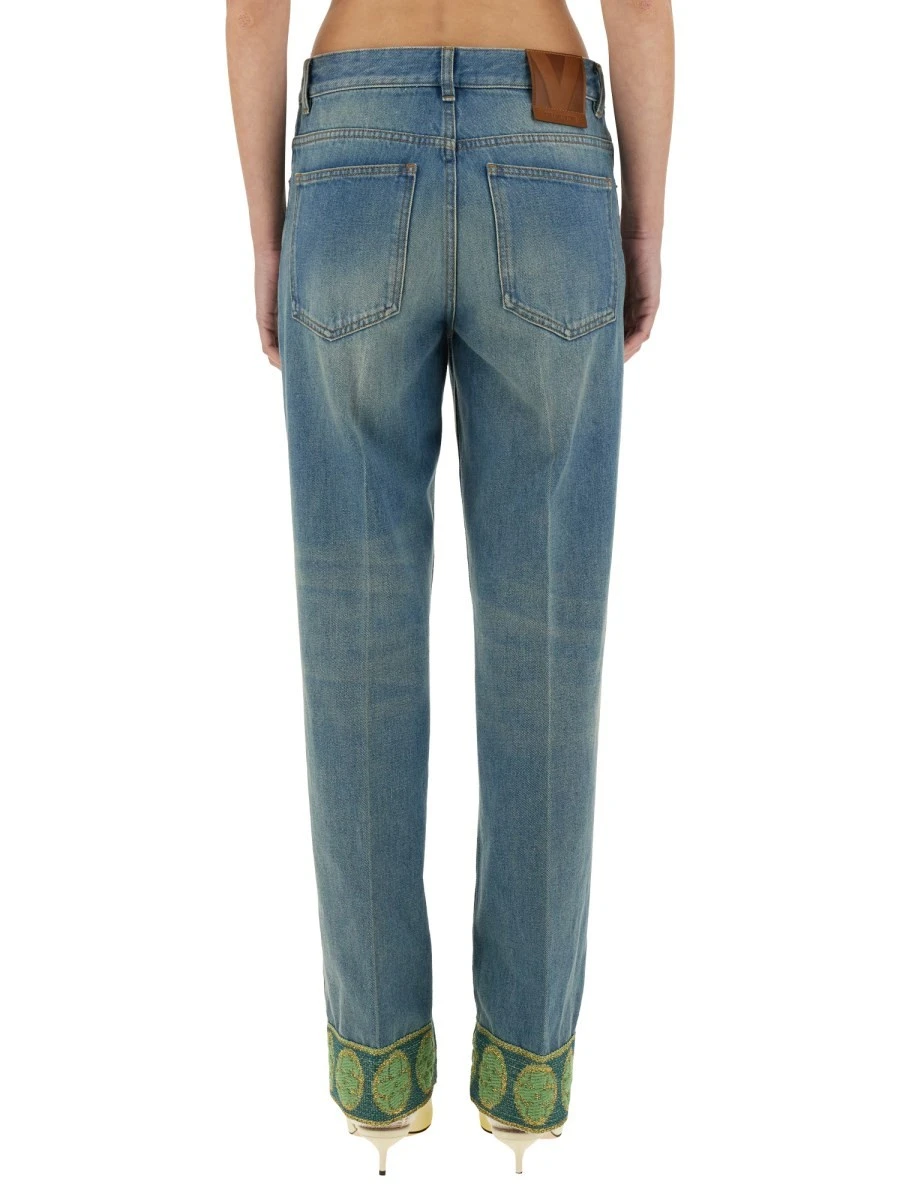 DENIM PANTS WITH JACQUARD EDGES.webp