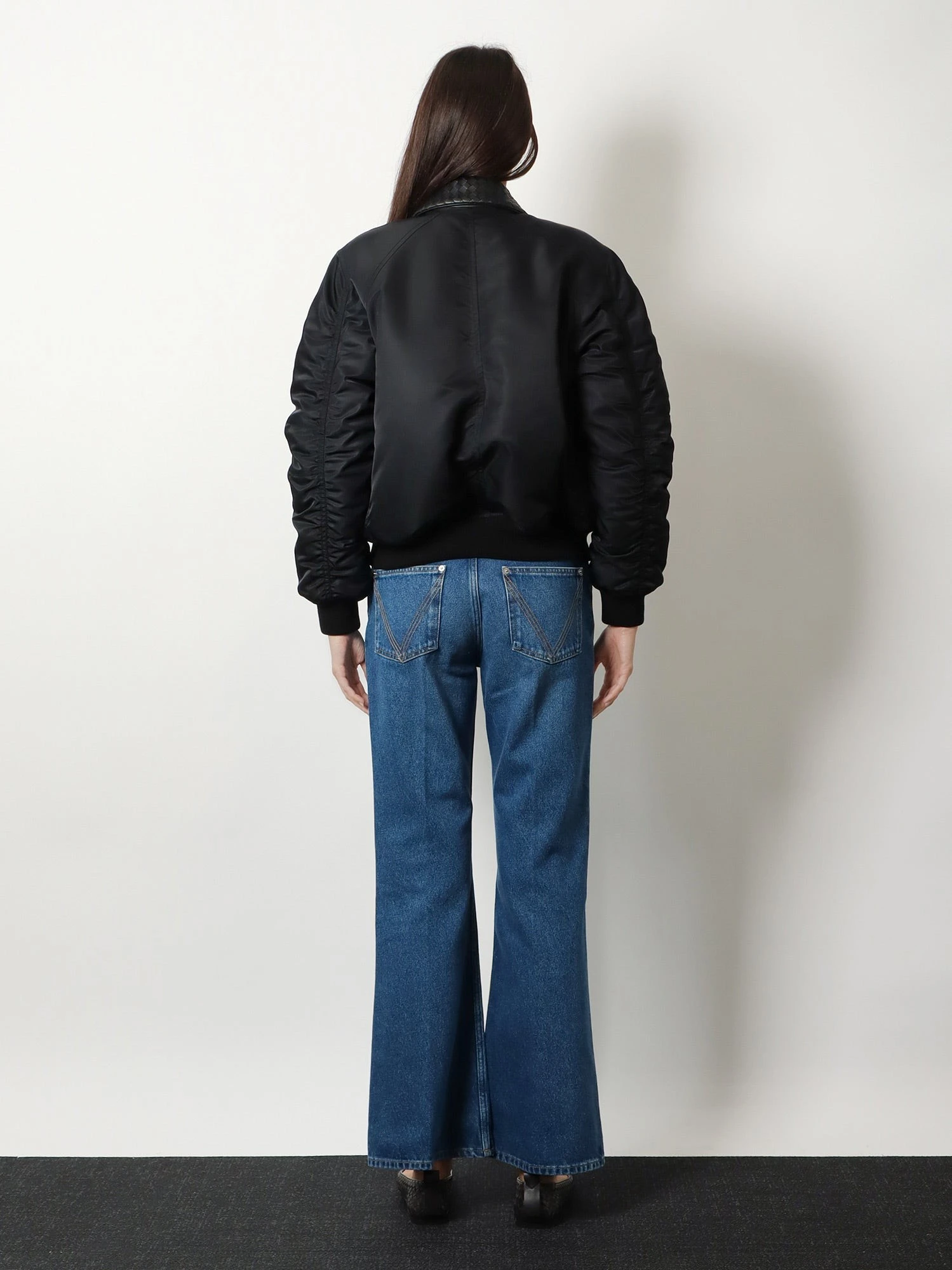 Nylon jacket with Intrecciato leather collar.webp
