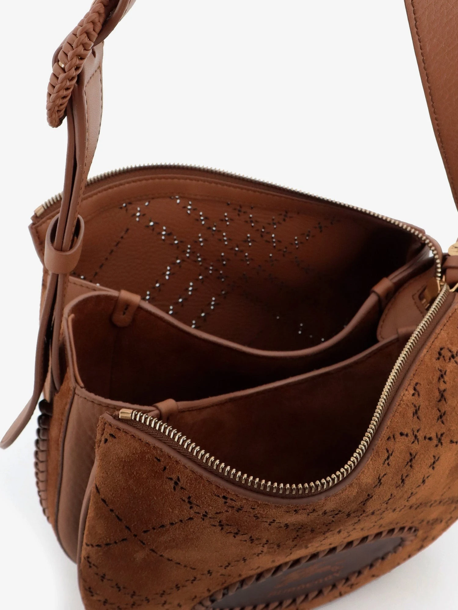 Tavistock suede crossbody bag with perforated pattern.webp