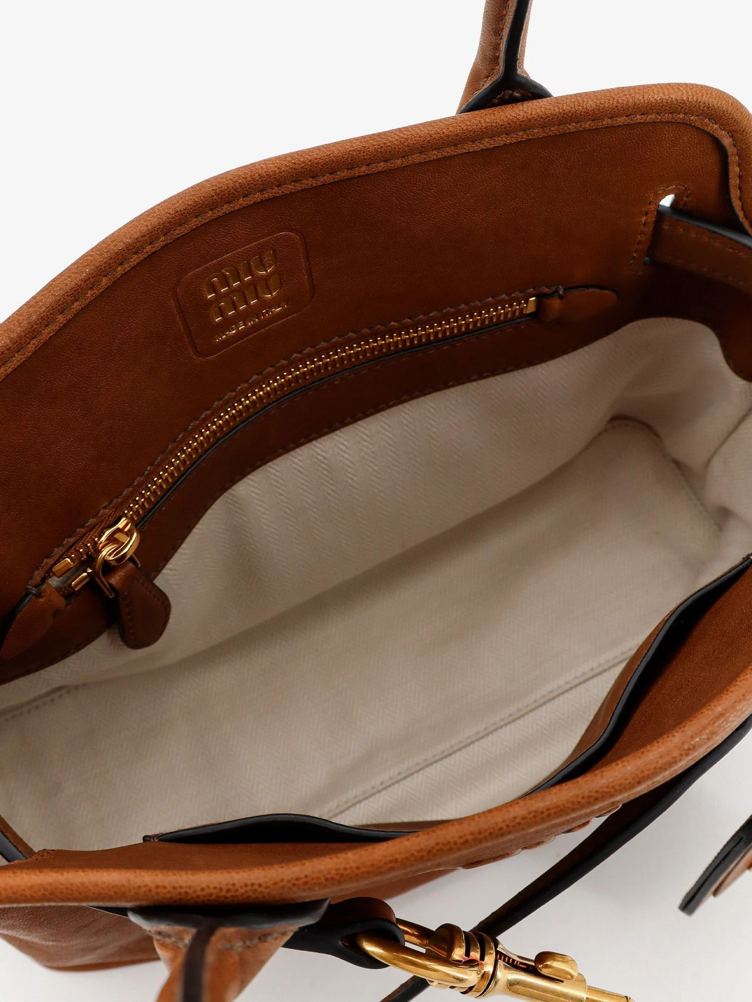 Aventure leather handbag with embossed lettering logo.webp