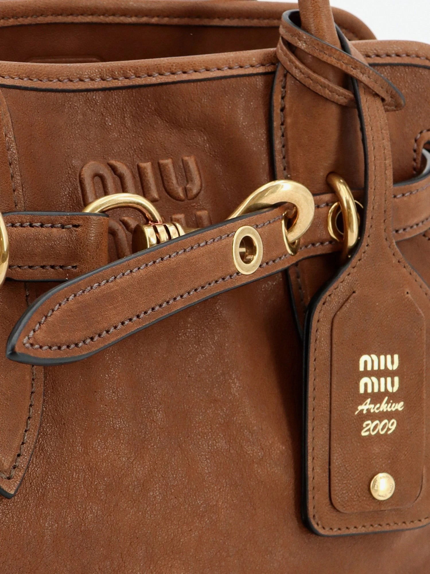 Aventure leather handbag with embossed lettering logo.webp